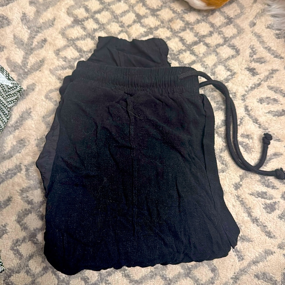 Black linen pant, which tapers at ankle